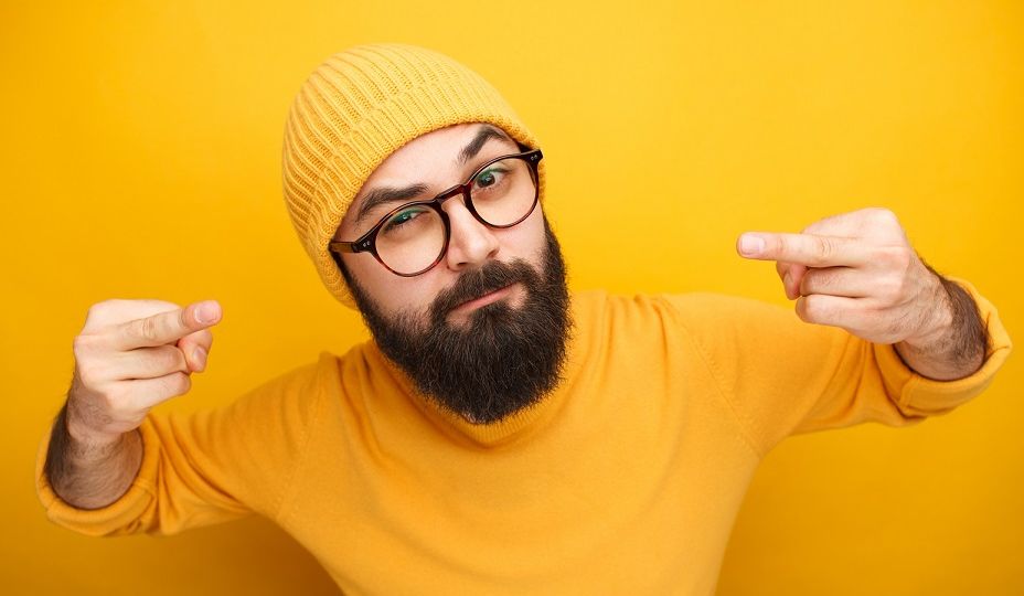 Man in yellow clothes showing middle finger