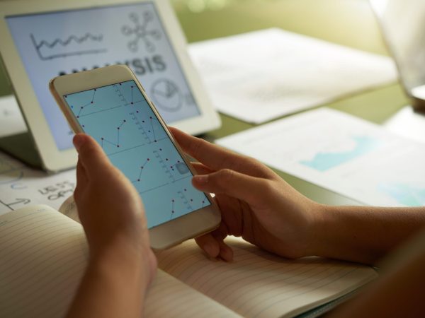 Close-up image of entrepreneur analysing chart of digital tablet